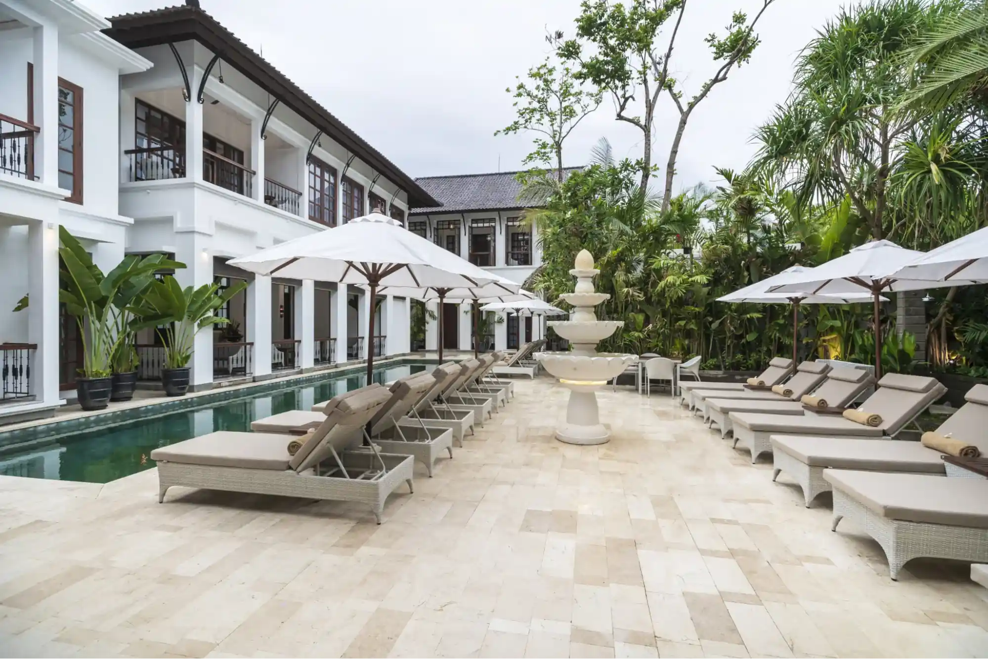 Poolside view of The Colony Hotel Bali, an adult-only boutique hotel in Seminyak