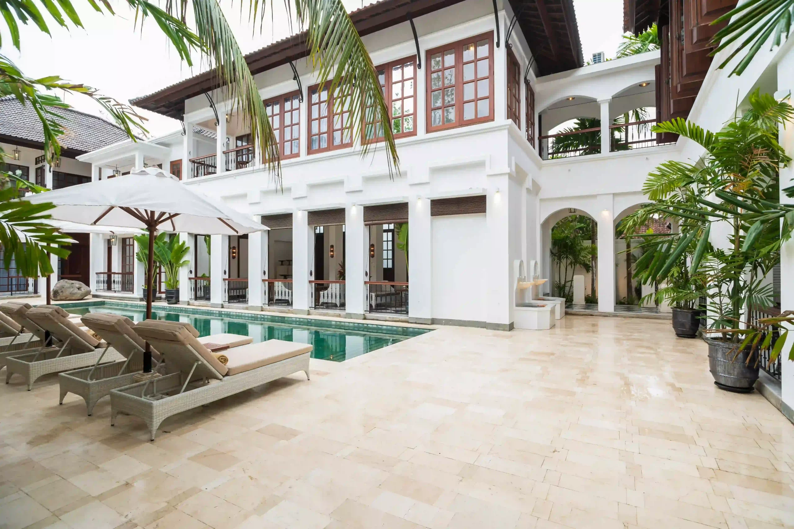 poolside view of a boutique colonial-style hotel in Seminyak, Bali