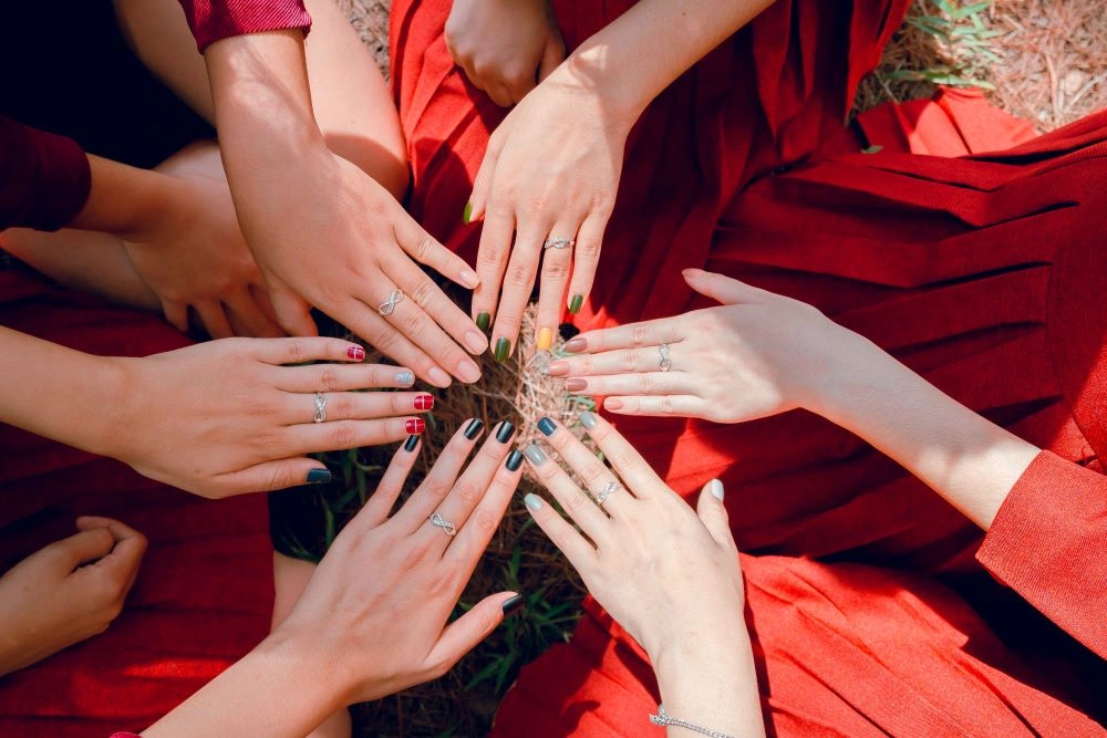 Top-down view of colorful manicured nails