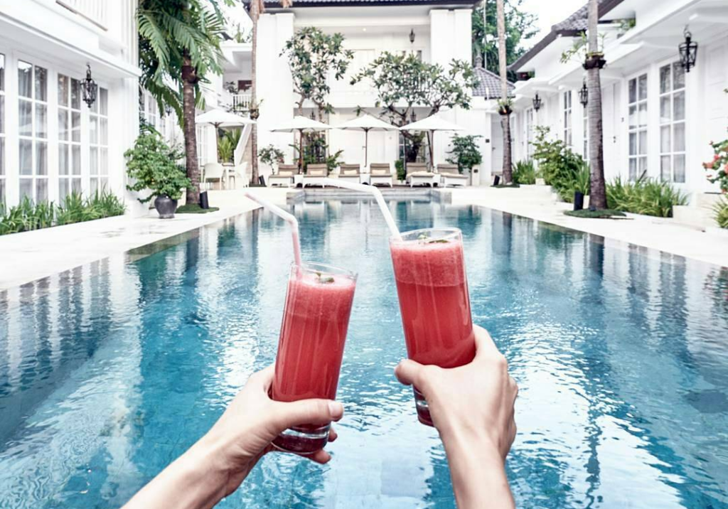 two glass of juice by The Colony Hotel Bali pool