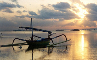 boat in a beach with sunset view