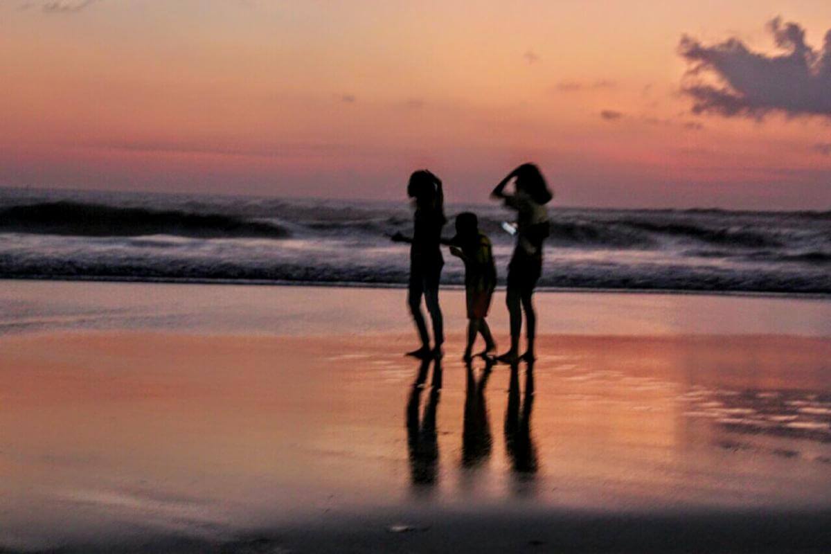 Kids enjoying the sunset on a Bali beach