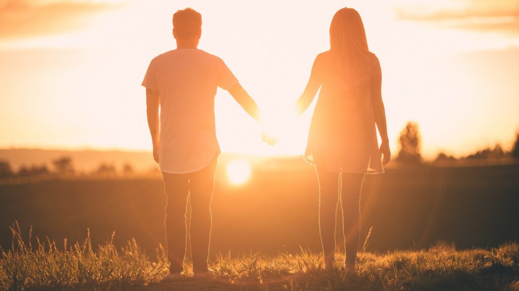 couples with sun in the background
