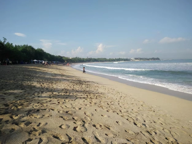 Seminyak Beach on a sunny day with clear blue sky