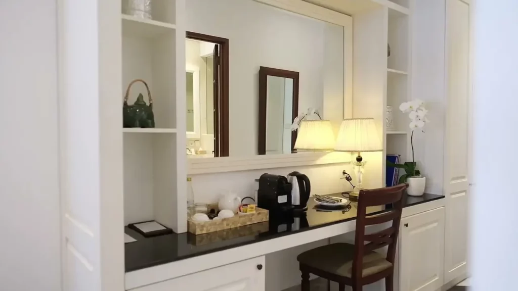 Club Premier Room Desk Area with Water Heater, Tea Set, and Decorative Touches at The Colony Hotel Bali, Seminyak