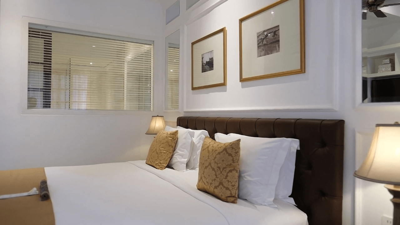 Comfortable bed arrangement in Club Deluxe Room at The Colony Hotel Bali