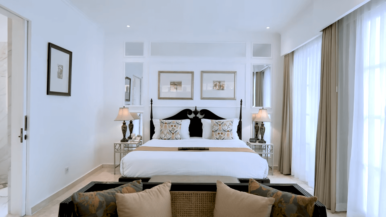 Cozy bed setup in the Junior Suite at The Colony Hotel Bali
