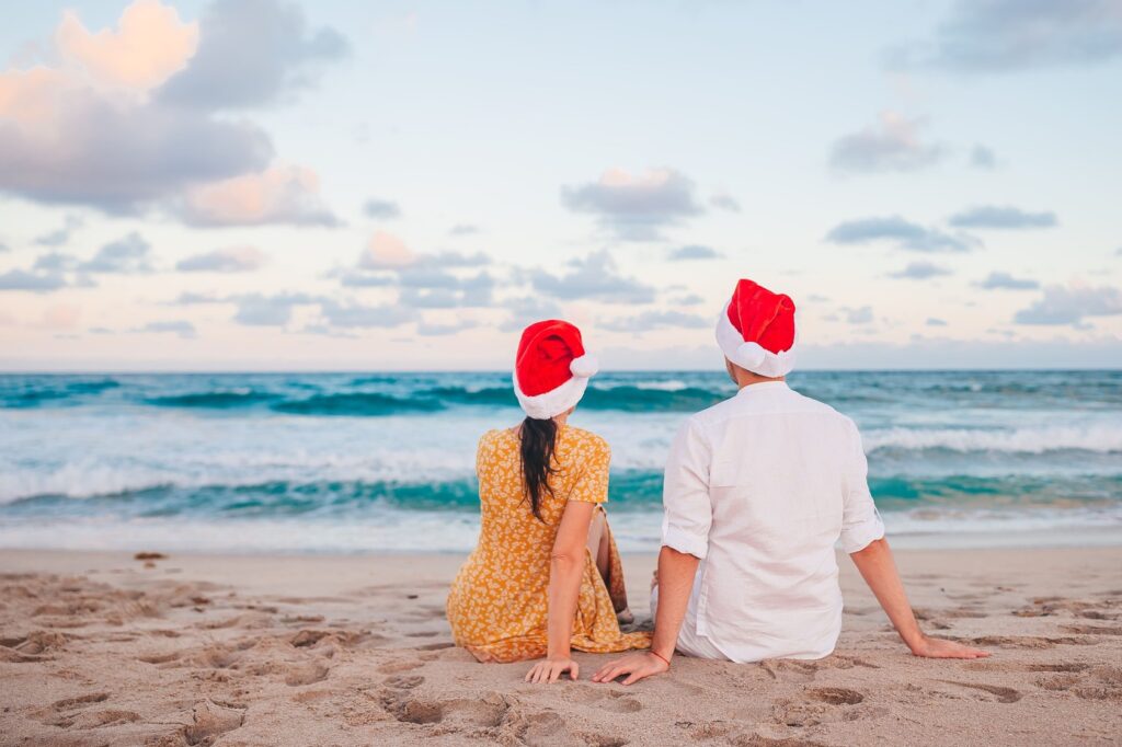 2025/05/happy-couple-santa-hats-christma-2.jpg