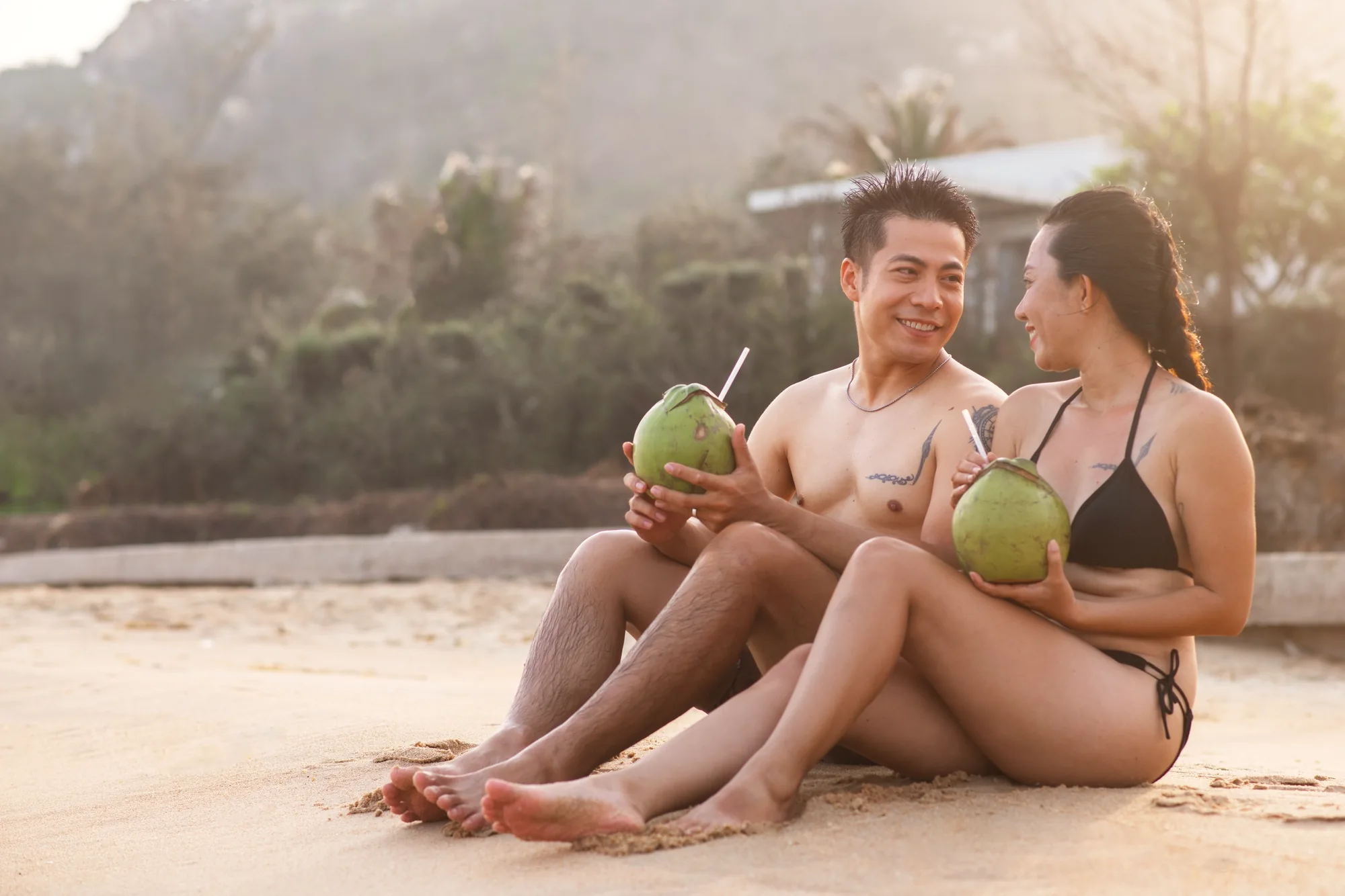 enjoy in bali's beach while holding fresh young coconut