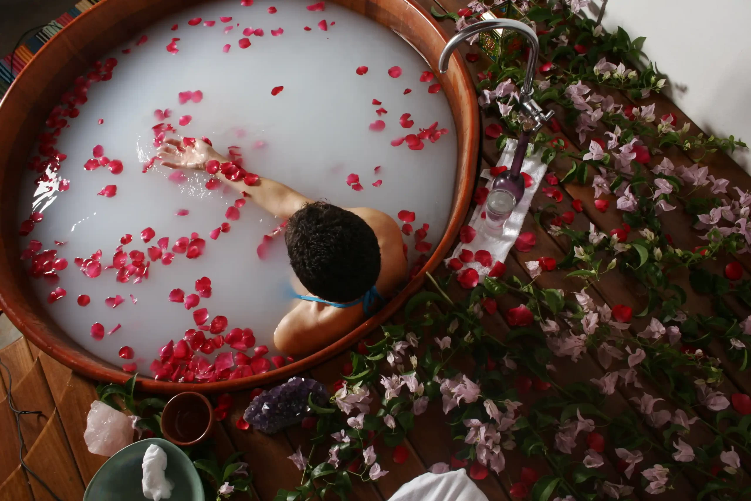 Traditional Balinese spa experience with a soothing flower bath and rose petals, reflecting what to expect from a massage in Bali.