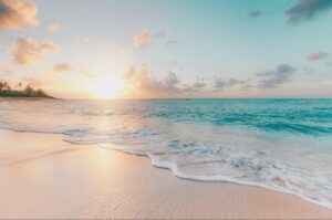 beautiful beach with sun and blue sea