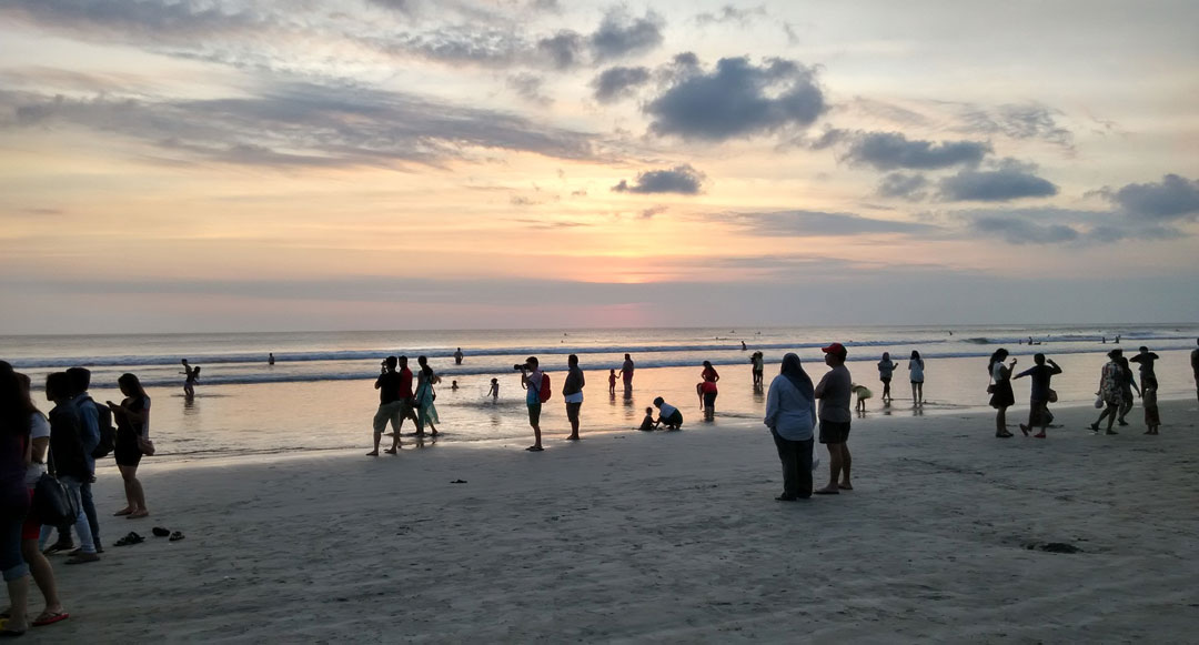 Beach in Seminyak Bali with local people